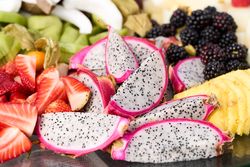 assorted fruits strawberries kiwi grape coconut coconut berries pumpkin dragonfruit