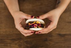 Woman holding Asian snack food