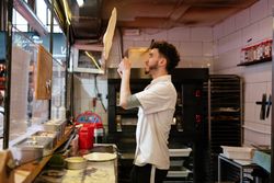 Pizza man throwing the dough in the air