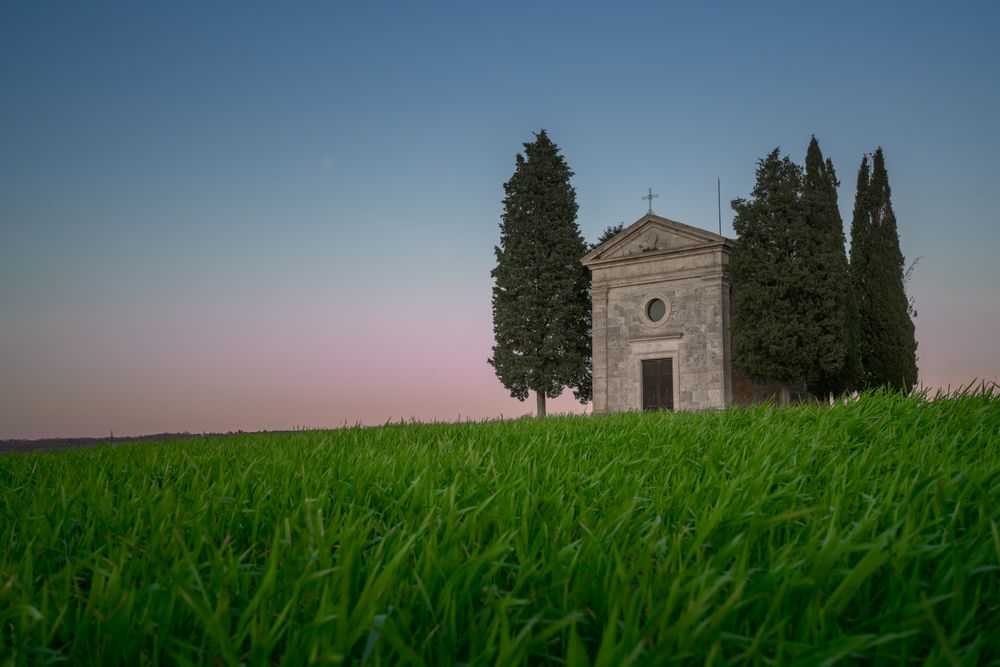 Single chapel among trees on field