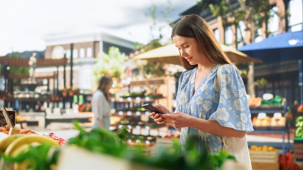 Woman Exploring a Farmers Market on Warm Sunny Day
