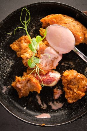 Appetizing cake with fig served with spoon