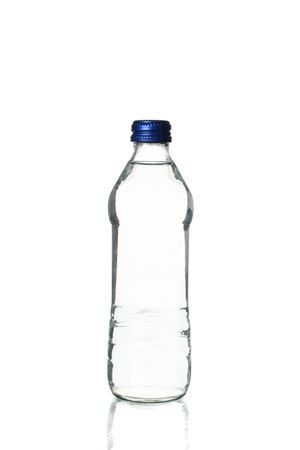 Plastic water bottle in plain room