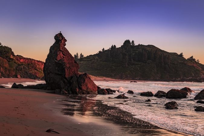 Calm waves coming onto rocky beach