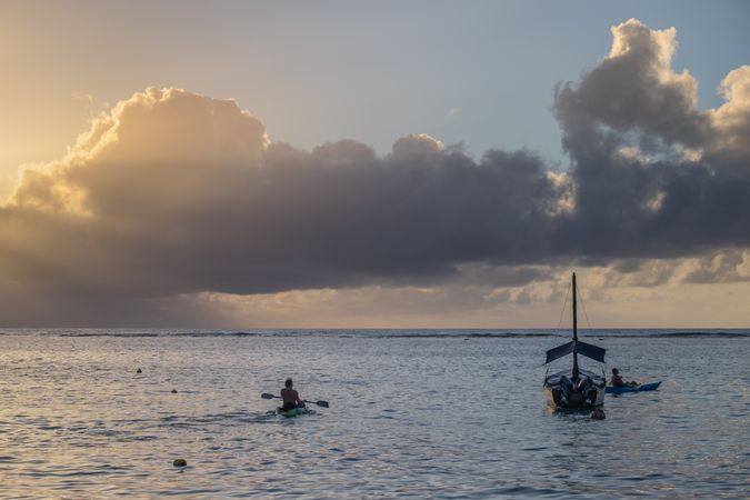 Two people kayaking at dusk
