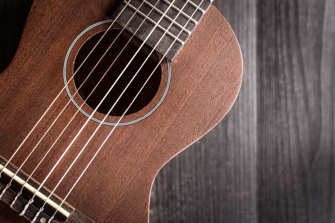 Ukulele on wooden tabletop