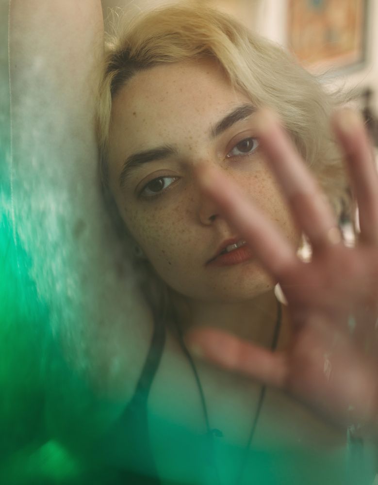 Charming melancholy woman looking at camera