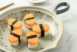 Plate of tamago, Japanese egg sushi on plate with space for text