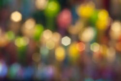 Defocused abstract bokeh lights christmas background, blur of bokeh circle light christmas festive backdrop concept.