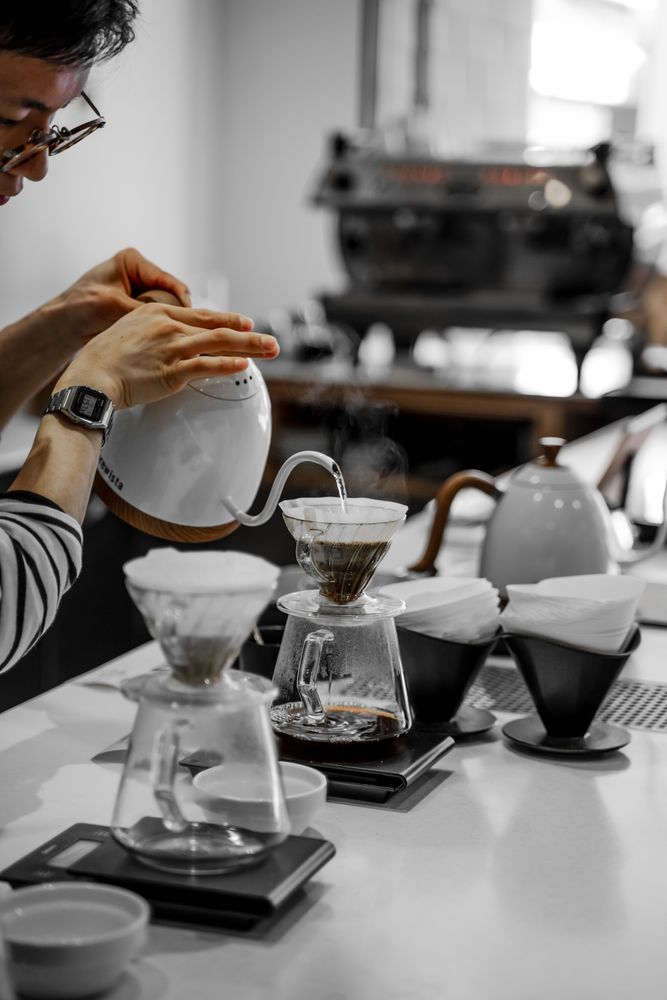 Woman pouring water in coffee filter