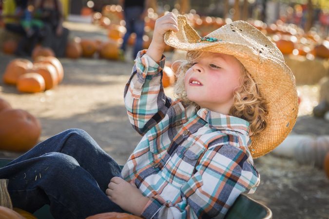Little Boy in Cowboy Hat at Pumpkin Patch