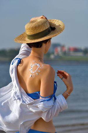 Woman with Sunscreen in sun shape