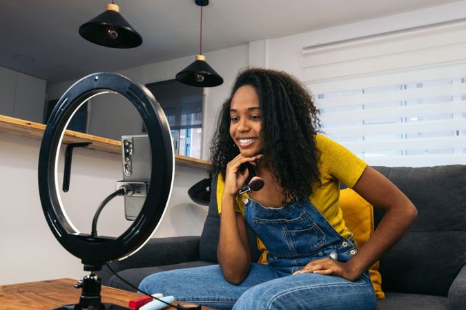Young woman creates content with phone