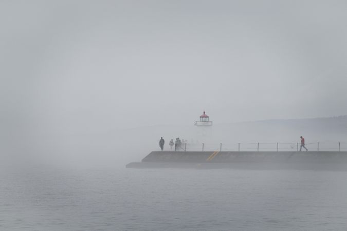 People emerged in fog on the way to a lighthouse on Lake Superior, Minnesota