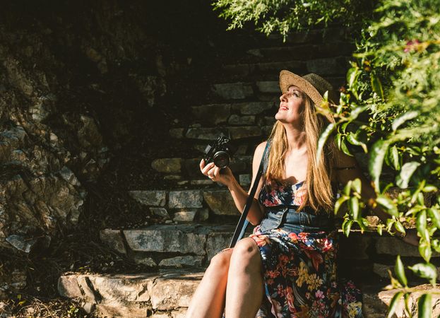Woman with photo camera on street