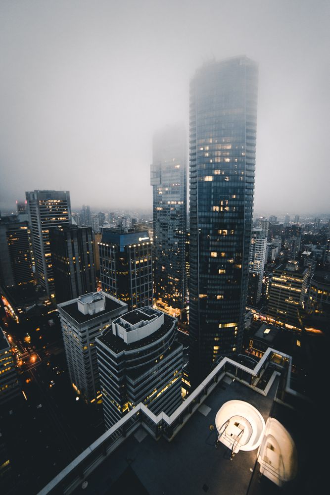 High rise buildings of Vancouver, BC, Canada under foggy sky