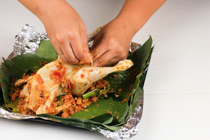 Ayam Betutu. Balinese Roast Chicken Stuffed with Cassava Leaves.