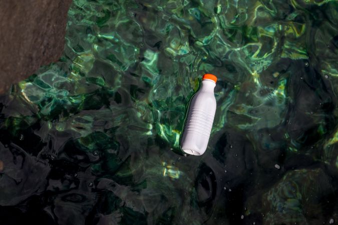Plastic bottle floating on water