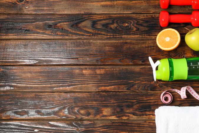 Flat lay composition with healthy lifestyle accessories on wooden background