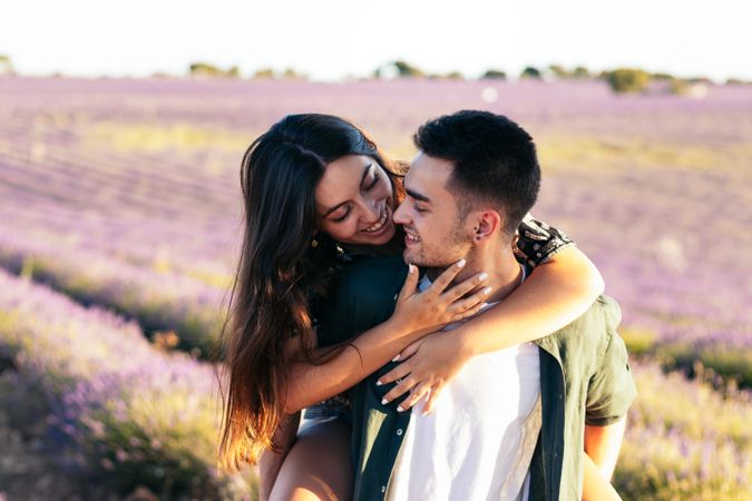 Lovely young couple in a floral field