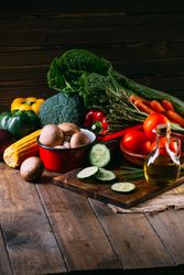 Vegetables and utensils on kitchen table
