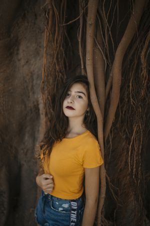 woman near plant roots