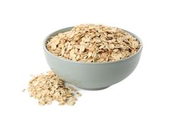 Bowl with oatmeal flakes isolated on plain background
