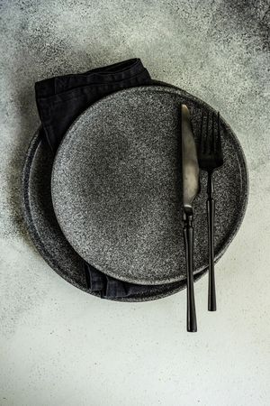 Top view of elegant dark grey table setting