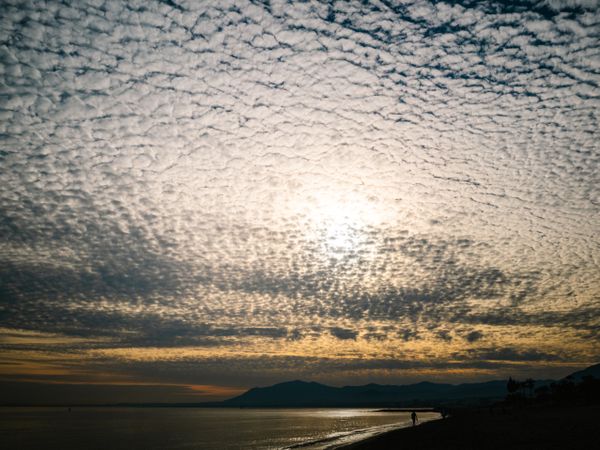 Picturesque cloudy sky at sundown