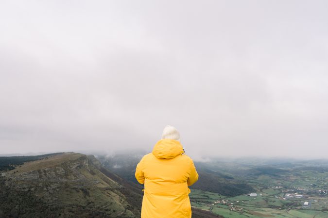 Man standing on top of hill