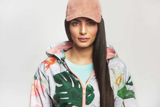 Confident woman pictured in colorful printed floral hoodie