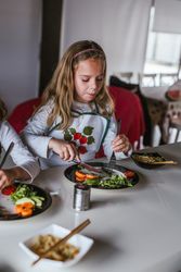 Kids eating vegan food at home