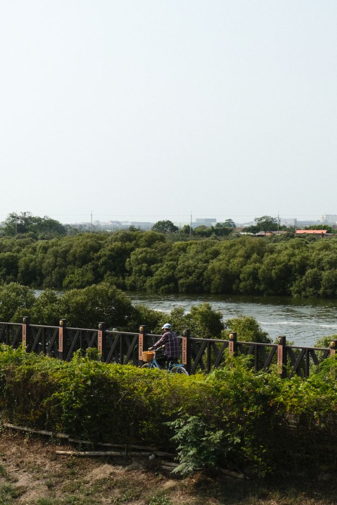 Man cycling along the river