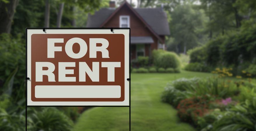 For Rent Real Estate Yard Sign in Front of House.