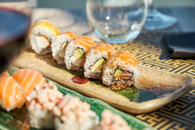 Delicious sushi served on ceramic plate