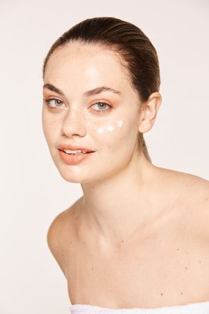 woman with cream on face