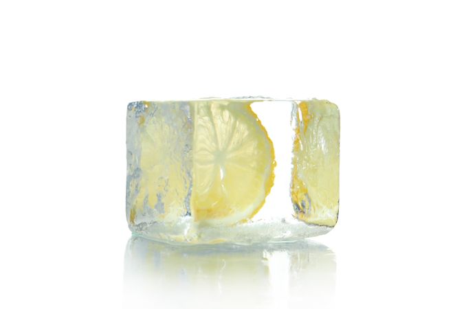 Square clear ice cube with lemon slice