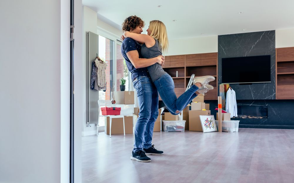 Couple hugging in the living room