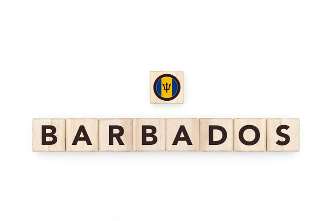 Wooden blocks bearing the name and flag of Barbados. Barbadian and Caribbean Culture, national identity, travel, and geography in a copy space design.