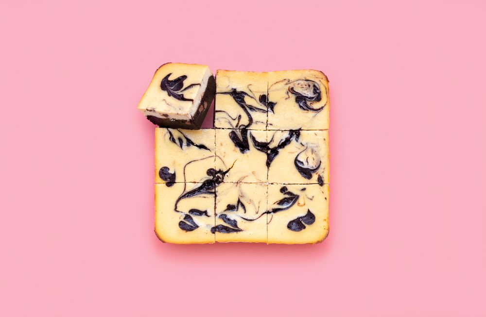 Cheesecake brownie above view isolated on a pink background