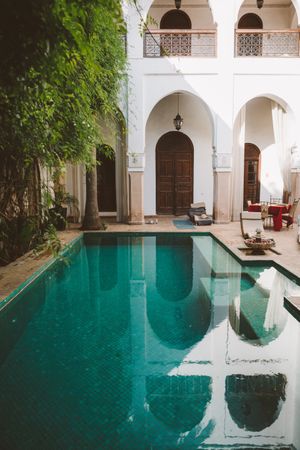 Tranquil resort pool in oriental patio
