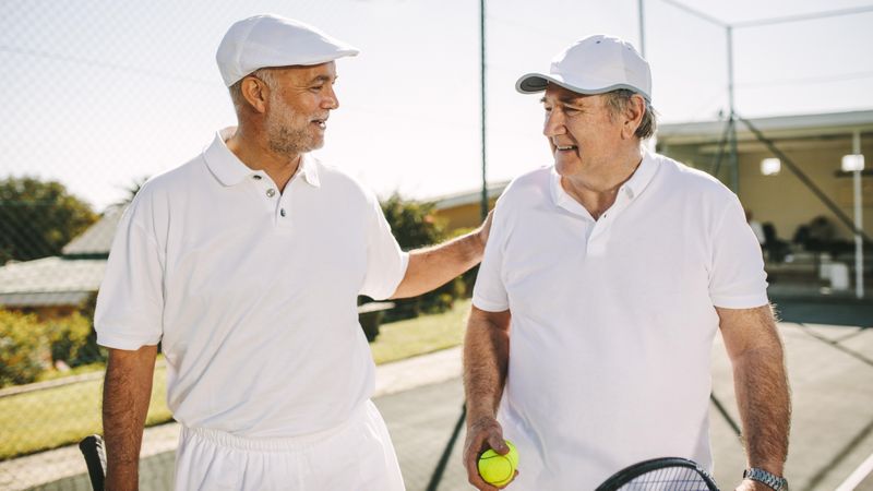 Two tennis players after a singles match