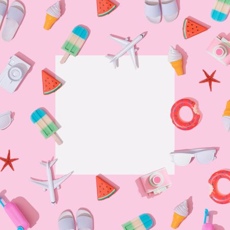 Beach items, like ice cream, camera, flip flops, on pastel pink background with paper card