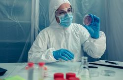 Scientist examining a petri dish in the laboratory