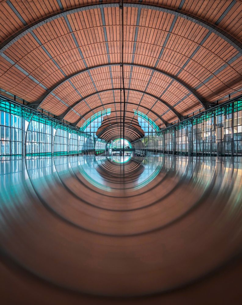 Wide angle photography of wide hall with floor reflection