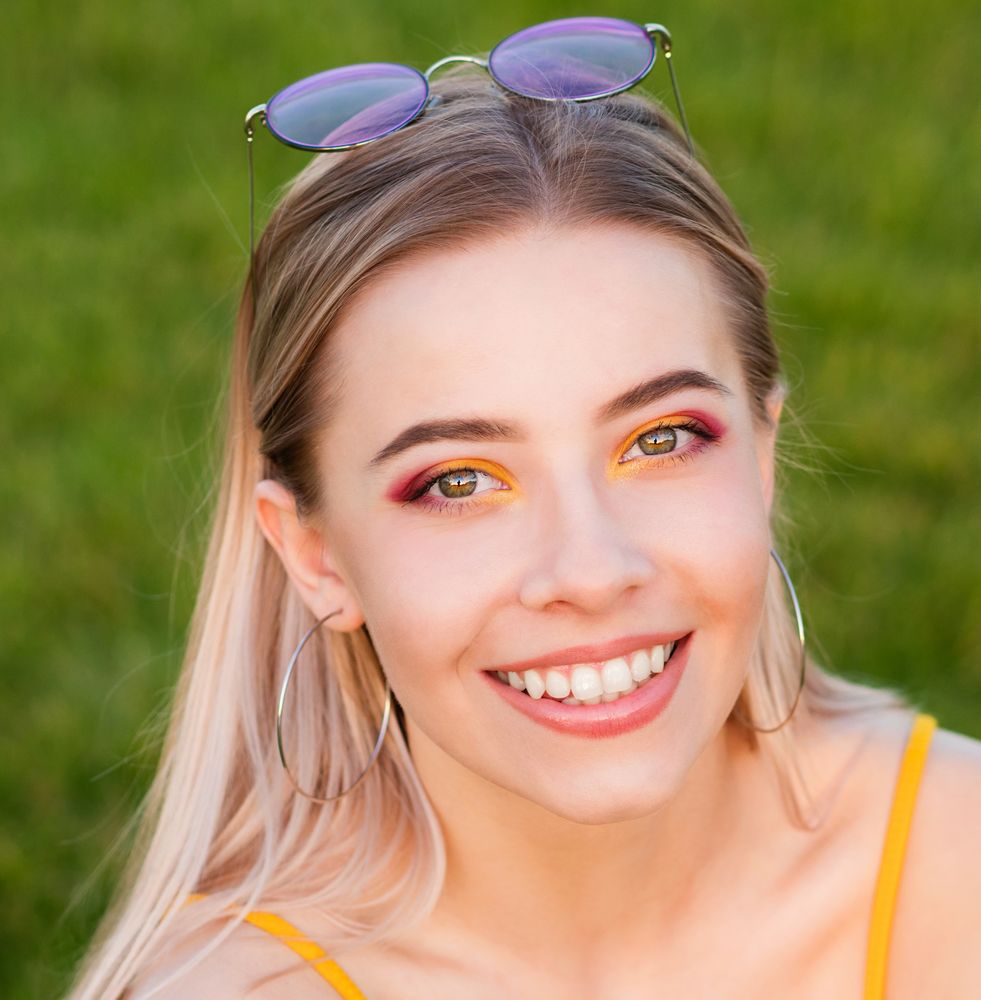 Portrait of a smiling female in field