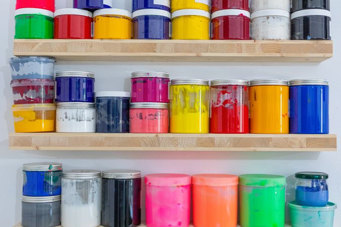Shelves with colorful tins of paint
