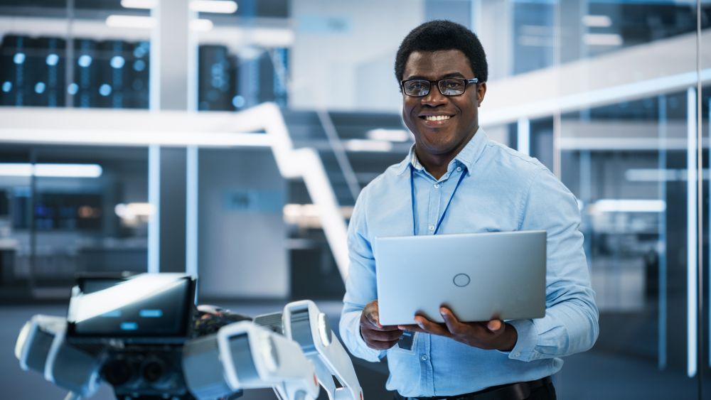 Portrait of a Man Wearing Smart Corporate Wear and Glasses, Looking at Camera and Smiling.