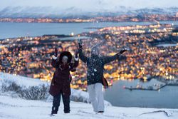 Cheerful couple having fun in snowy weather