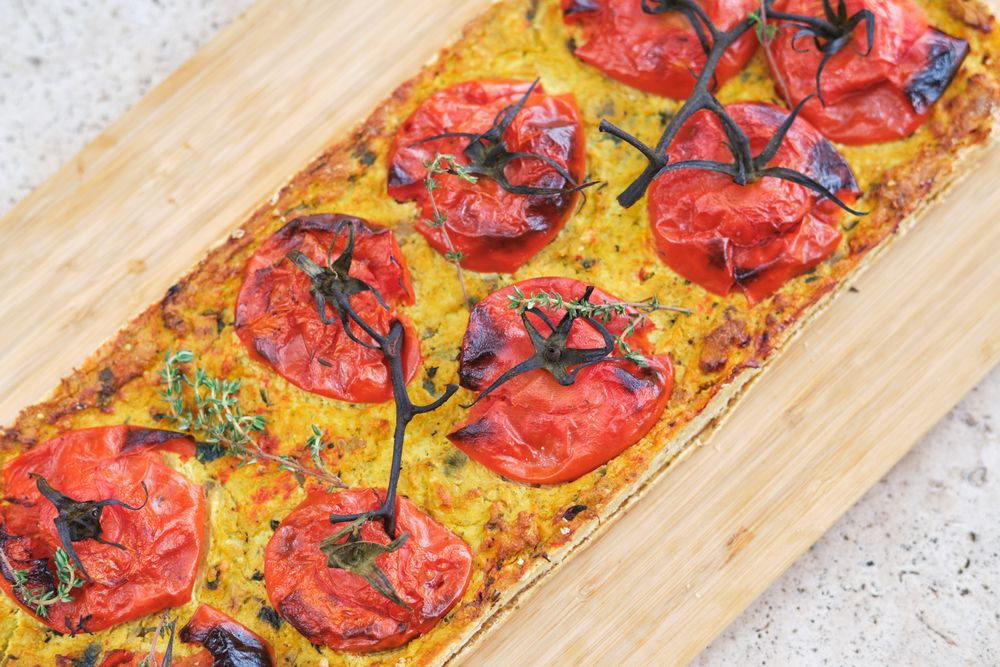 Tasty pizza with tomatoes and fresh thyme